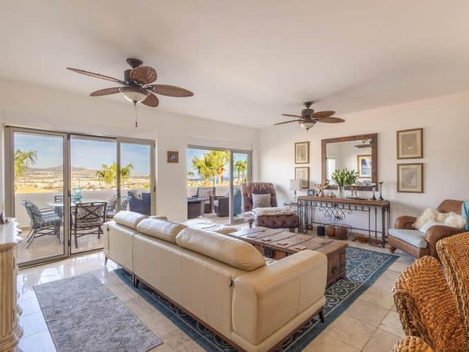 Pedregal Ocean View Hillside Living Room With Spacious Seating And Natural Light.